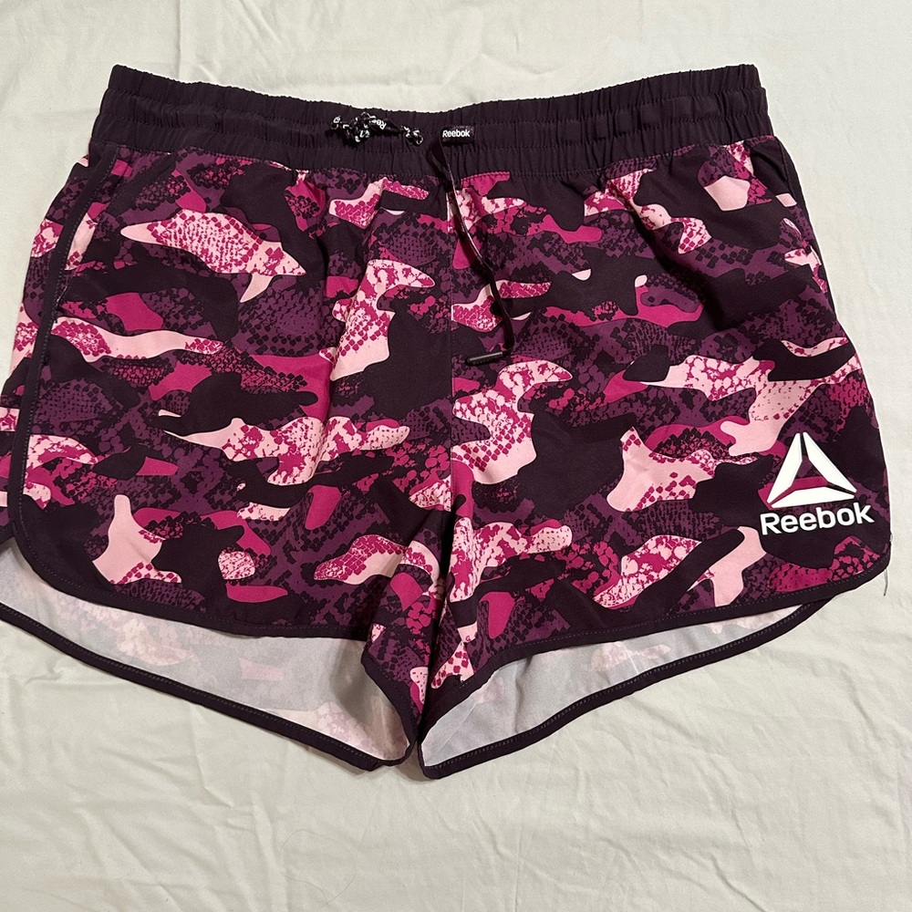 Reebok running shorts with built in lining in size Large